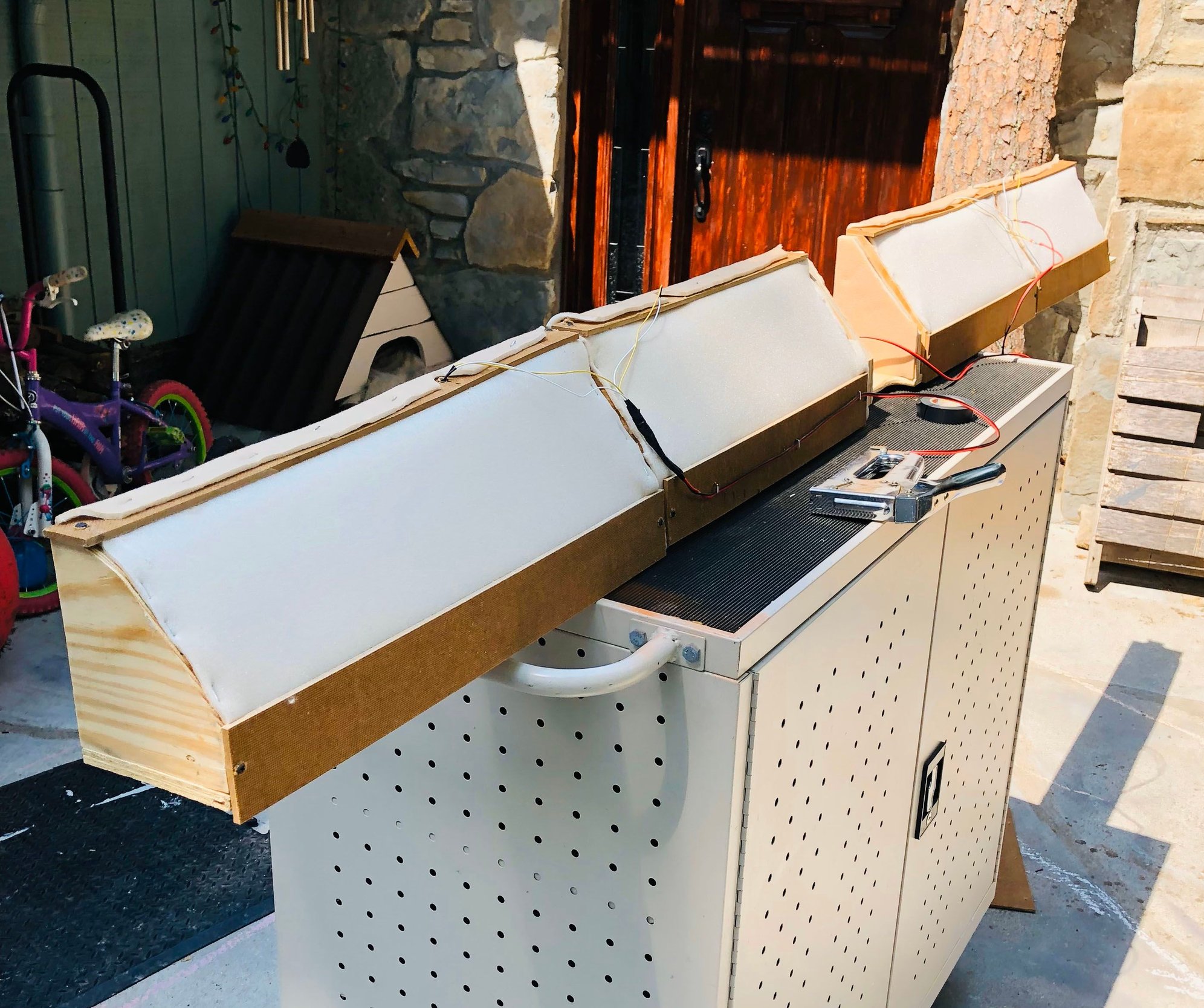 The back of one cubby unit showing its construction and lighting
