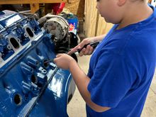 But of course, the first one he did, he knocked it clear into the block and I had to dig it out. There’s nothing like learning when you make a mistake, but this was an easy one to correct and he did the others perfect. So then after we got those out, we were scraping the crud that was right around him cleaning the holes out getting them ready for the new ones and then his friends came by and he decided he wanted to go play.