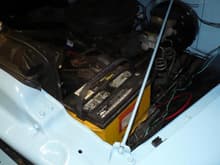 battery under hood   front drivers side location