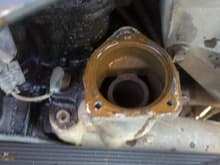 Thermostat housing and thermostat pulled off, water pump is ok for now.. just flushed it and was done with it. for now.