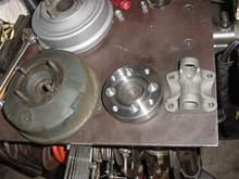 Pic showing the adapter I machined to mate up to the Chrysler brake drum (push button trans all had some sort of drum similar to these. The piece on the right is off the shelf - I think it was  a Spicer piece.