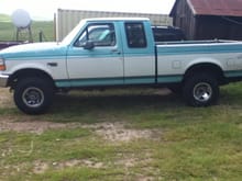Pickup with 31 inch tires and body lift on