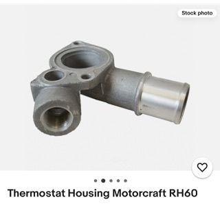 Heres the housing, the thermostat fits in the groove  and the gasket is on the housing, not the thermostat