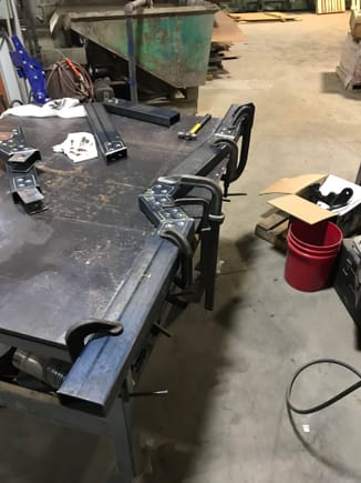 Got everything all lined up. I used the edge of the table as a straight edge and measured all the angles to make sure they were spot on. I ended up adding two more clamps cause the welding process warped it like crazy!