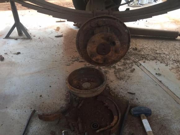 After a lot of work, the brakes disintegrated and the drums came off.