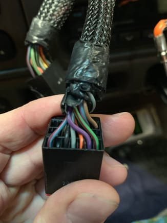 The SWC wire is the LB/RD in far left position in this photo. It’s terminal 14 in the diagram of C290b. This is the plug on the rear of radio which contains all the rear entertainment connections.