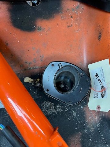 Steering column grommet attached to metal backing plate with two handmade staples.  I used Tig wire to make the staples