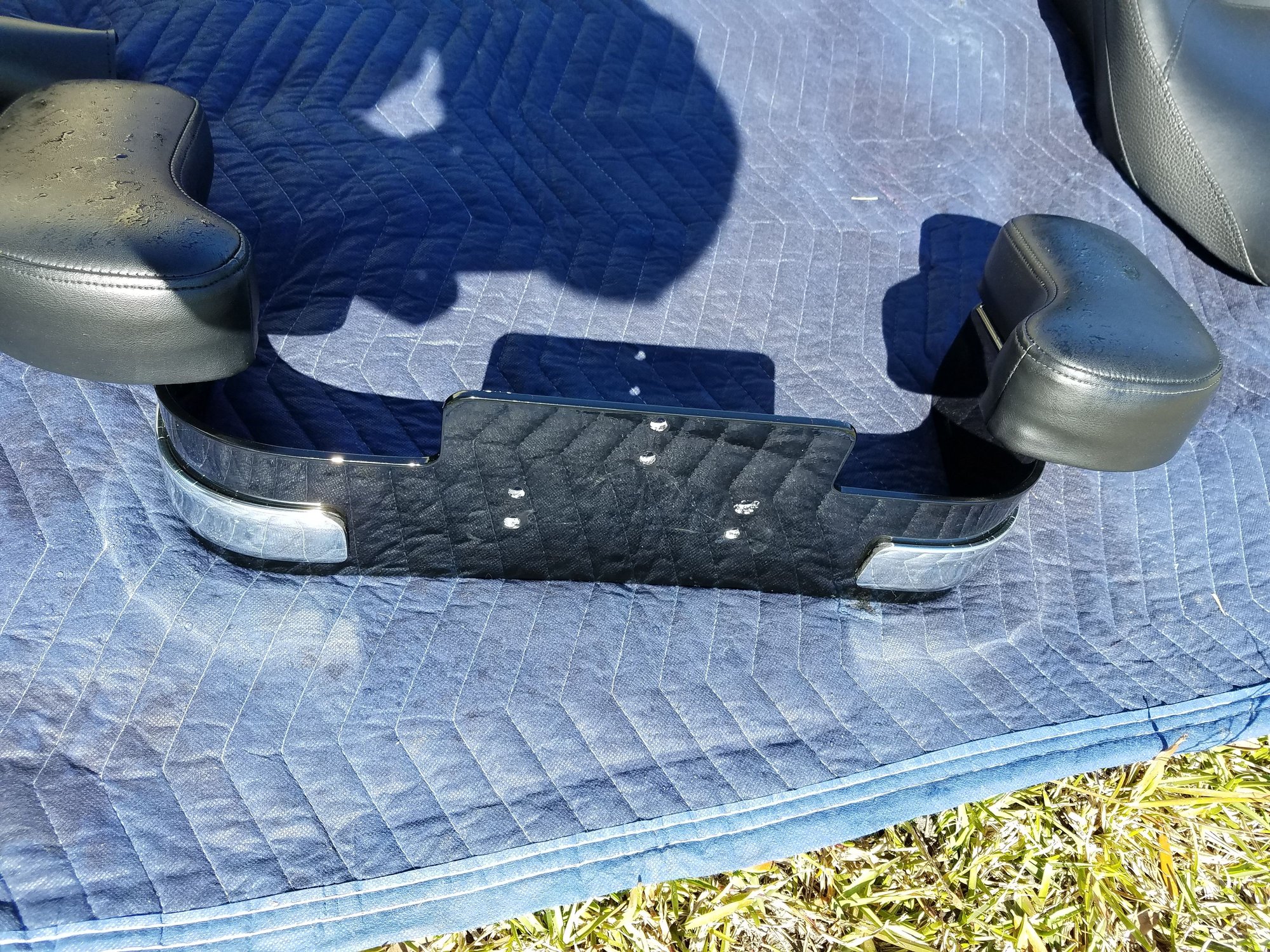 wrap around Armrest that attaches to your existing back rest. Harley