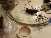 Trimmed braided hoses (first go round).  taped the area to cut and used the dremel tool with diamond cutting disks.  could have been done a number of ways but, i need a dremel tool anyway for my jeep (rust abatement), purchase justified.