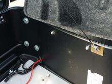 I ran the power cord out to the battery through the existing hole in the Tour Pak.  I installed an inline fuse before connecting to battery.