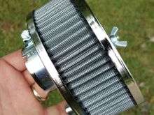 As shipped: EMPI #9044 from Dune Buggy Warehouse, about 20$. Cut the back flat, and plugged the emissions hole with a 1/2" chrome furniture plug. Drilled 3 5/16" holes using carb bracket for pattern.