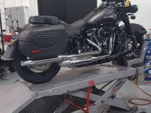 Industrial gray and black denim. Having some stuff put on it. Nothing fits except my windshield bag! Looking forward to leaving the dealership.  6 hours and counting.