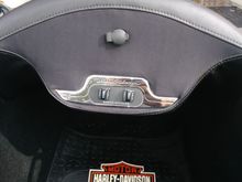 There are two small speakers hidden behind the speaker cloth. Volume controls and station up/down button for the sidecar.