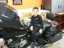 At the wake at our house. My niece Lindsay’s little guy Jace. Harley Davidson is in good shape for the future!