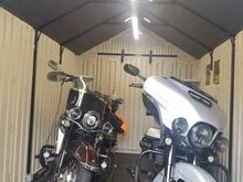 My bikes in their new home.  Floor is also resin and kind of soft, so need to put pucks under the kick stands,  will be installing some permanent steel plates so I wont have to fiddle with the pucks each time I park the bikes.
