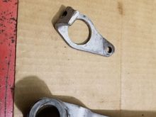 Assembly with cam/bell crank cut off