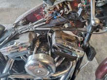 Here you can see i took the right side tank off yo do a couple of things, first to chek out the wiring harness,  turned out to be ingood condition i also wanted to change the Ape hanger length throttel cable, the rocker boxes need a good cleaning, check out the fuel filter with braded steel lines ! (Total Custom hey)
