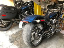 Anniversary 114 Fat Boy Kuryaken curved plate mounted vertical, custom dynamic LED tail lights with smoked lenses, & Rineharts Slip Ons.