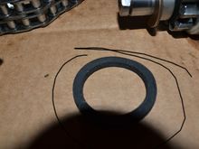 Where does this SS felt spacer go as it appears oversize to fit on outside of IP case between SS and case??  