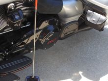 I added pouches on each side that attach to the Saddlebag bars.  I keep my puck ing the left side one that I can reach with out getting off the bike.  The puck has a metal piece and the  colapsible wand has a magnet on the end that allows you to set or pick up the puck, again without getting off the bike.  $20 from Hardstreet at their booth during Daytona Bike Week (www.hardstreet.com).