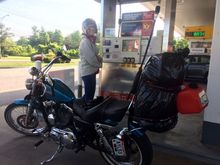 This is how all our road trips start out (see gas station picture). Riders who has a “48” or “72” know this sight very well as the small 2.2gal tank needs topped off very frequently. Also a keen eye will notice my bike is set up in ”touring mode” aka, a sundowner seat and stock shock adjustment and of course the small gas can dangling off the bag. 
Of course my wife is smiling as the old saying goes. “even the worst day on the Harley is better than the best day at work”.
