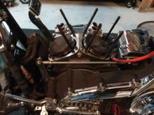 Heads and jugs off.  Nasty tops for only 20K on the engine.  popped off the c-clips and pushed out the wrist pins. 