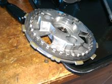 SM is wrong about how to install the cover. Place only the first friction and steel on the pressure plate.  SM says friction, steel, friction but it's easier to put the one friction in the clutch basket.