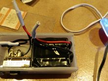 There's 8 hearing aid batteries in the little "try me" battery that the lights come with!  Later I can sub a 9V battery when they drain or get some cheap ones.  BUY THE SET ON THE BACK OF THE HOOK, no 5 year olds have stood there pushing it's button for a half hour, should last a long time at only a minute or so per use.