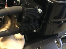 I removed the coil pack/plug wires cause it's easy and it gave me more room. There's a electrical connector that plugs in behind the coil to a plastic holder, don't know what the connector is for, but it is not used. It doesn't have to be removed. Only 2 Allen heads secure the coil pack. I removed the plugs to make it easier to rotate the crank.