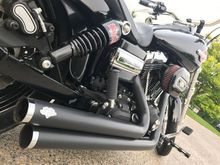 Vance and Hines 2 into 2 pipes, burly shocks, Screaming Eagle air cleaner, 1964 style Harley tank emblem, forward controls, CNC pegs and CNC timing cover shown in this image
