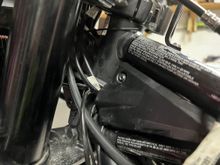 Wire going into bike where factory wires go in.  Tank is off.
