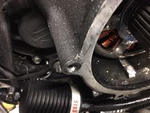 clutch piece jammed under the alternator.
