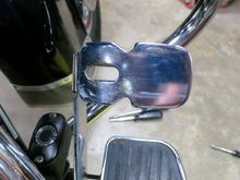 Here's the pedal, those two indentations (top & bottom) secure two tits inside the rubber pad making removal a huge pain in the ass.