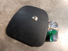A waterproof momentary switch paired to a Chamberlain universal remote on the right lower cover  is how I do it. I put the remote in a Zippy bag and Velcro on the back.
