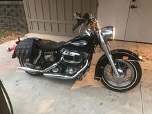 These are pix of my 84 FLHS, it has just under 5K miles. I took the seat off so it didn't get damaged and put the rack and throwers on it. I think Ill ride it on an AMCA road run this year. 
