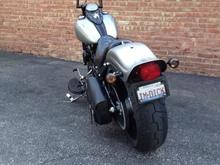 5/1/13 - With Metzeler 140/70-21 mounted on Black Bike 21x3.5, Burly 1.5" lowering kit, Vulcan 7.5* rake kit, Nash 14" Gimps and blacked out motor.