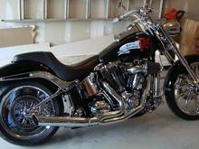 Fatboy Transformation 3 - solid billet rear wheel and lowcat pipe. Who knew5