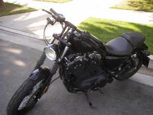 Drag bars with 6" riser, relocated speedometer, new light and assembly, flipped over mirrors, Progressive shocks, Hance and Vines Competition exhaust and fuel pack and a Screaming Eagle Stage 1 intake.