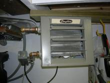 Ran forced hot water heater into my 2 car garage. works sweet. keeps the chill off and helps heat the room above during the winter