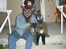 Me with my grand son, my grand daughter trying to get my wolf mask off.