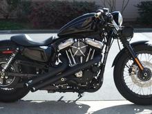 '09 Harley Nightster with V&amp;H Sideshots, RSD Venturi Air Filter, 32" drag bars, flat-black powdercoated primary panels, speedo-less bar clamp, relocated speedomoter.