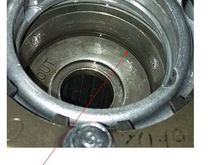 That is the cutout just above the washer for the spring i think.