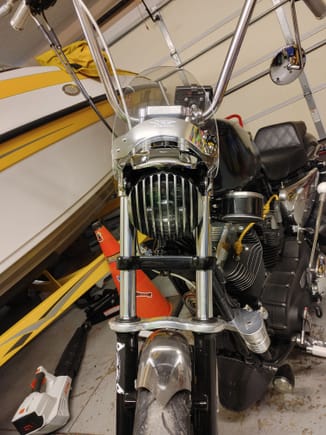 showing the modified hood that i wanted to keep, mounted on top of the joker machine headlight bracket.