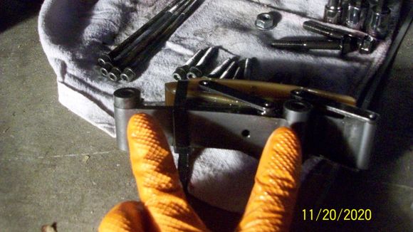 There are two spacers on the back of the tensioner.