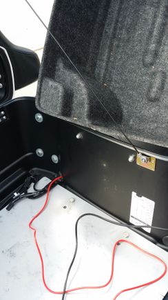 I ran the power cord out to the battery through the existing hole in the Tour Pak.  I installed an inline fuse before connecting to battery.
