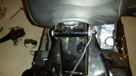 loosened bolt and nut on tank rear
