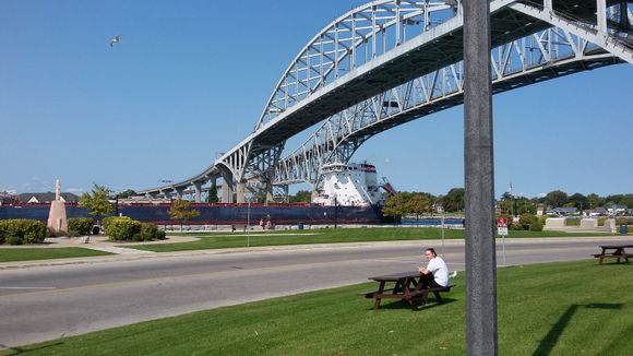 A Freighter just happened to pass under the bridges.