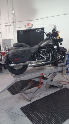 Industrial gray and black denim. Having some stuff put on it. Nothing fits except my windshield bag! Looking forward to leaving the dealership.  6 hours and counting.