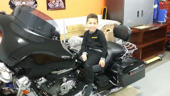 At the wake at our house. My niece Lindsay’s little guy Jace. Harley Davidson is in good shape for the future!