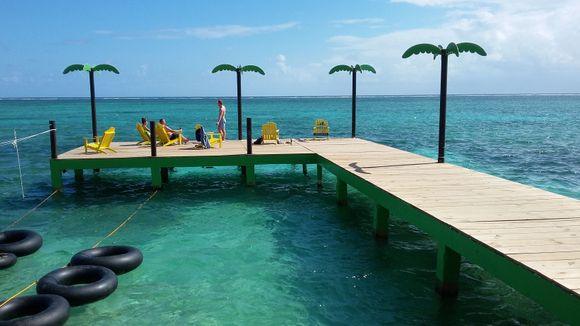 Signature inner tube floating and they serve you beverages in a bucket lowered to you.